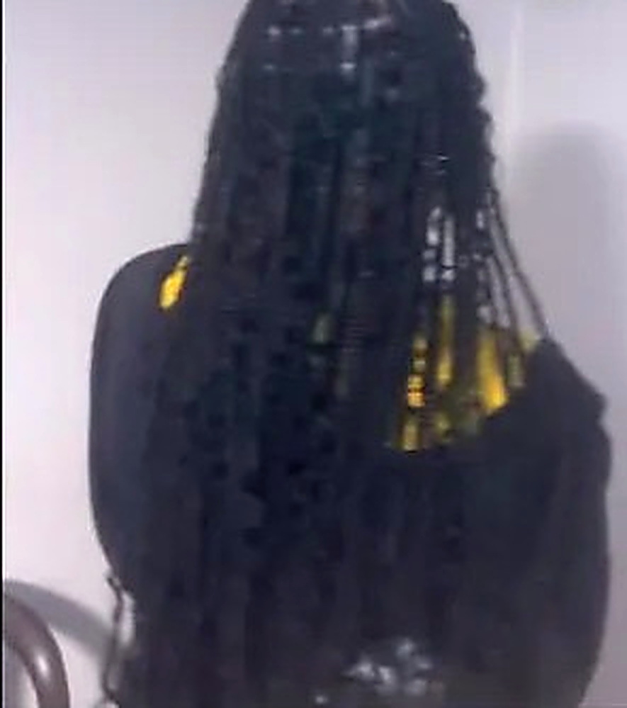 Braids finished with gold hair cuffs