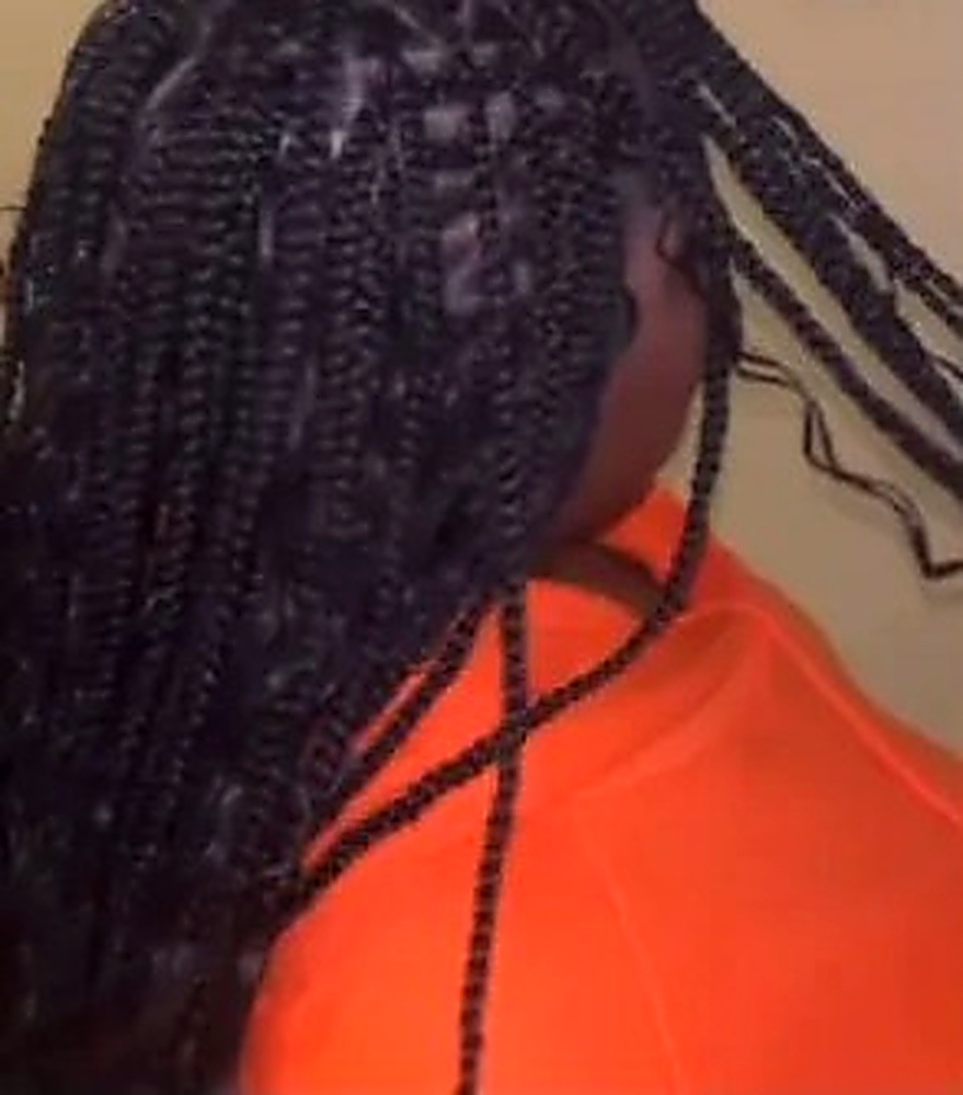 Long braids styled straight down the back